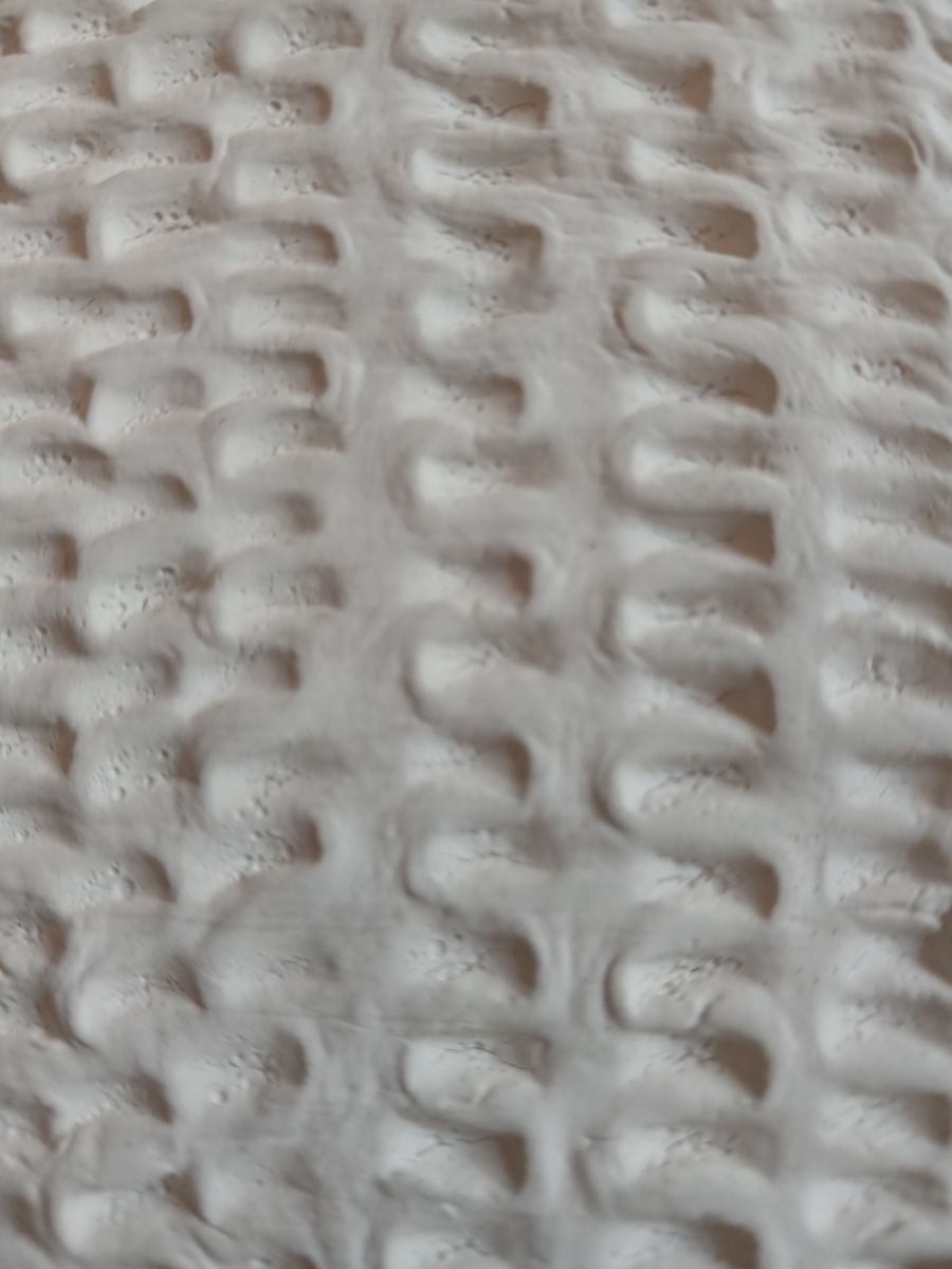 Foto ravvicinata del rilievo Ordito inciso a mano